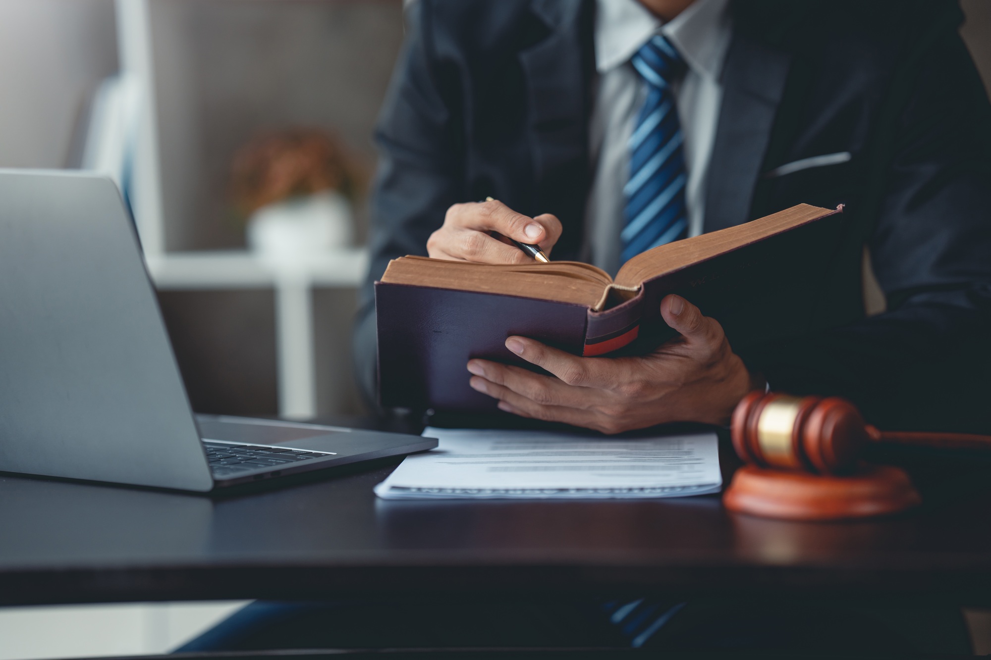 Businessman and lawyer look at contract terms in law, discuss contract document. Treaty Law. Signing